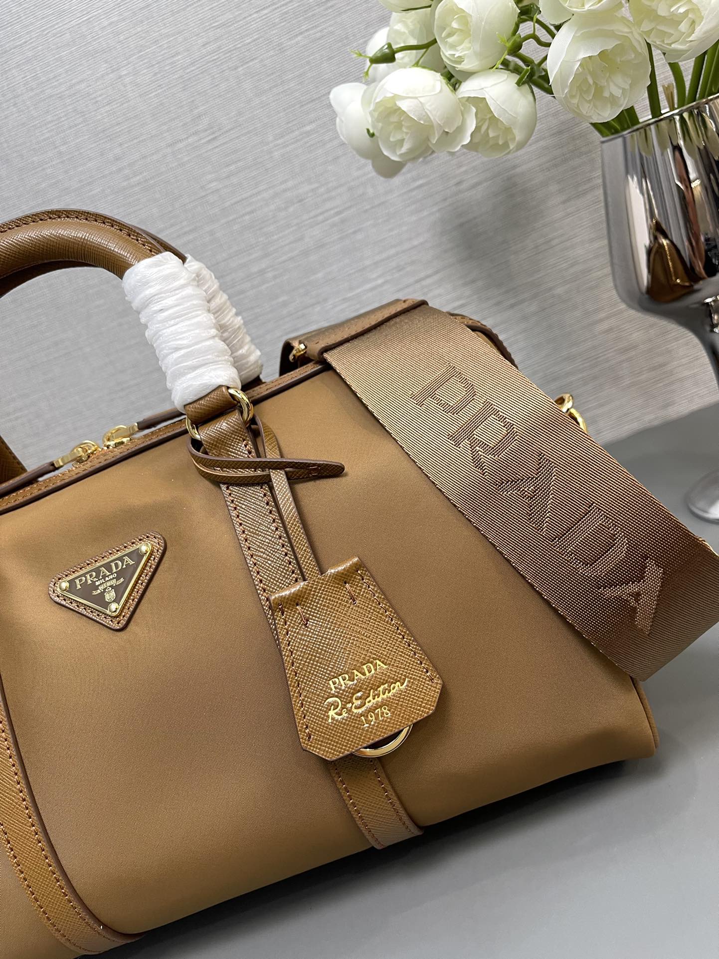 Prada Re Edition 1978 medium ReNylon And Saffiano Leather Top Handle Bag Cork Beige 1BB233